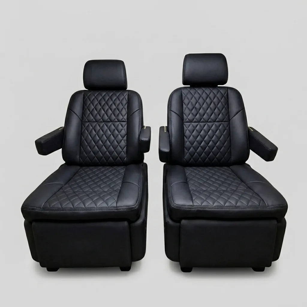 Premium black quilted leather captain's chairs reclined with footrests extended, showing electric reclining and footrest adjustment
