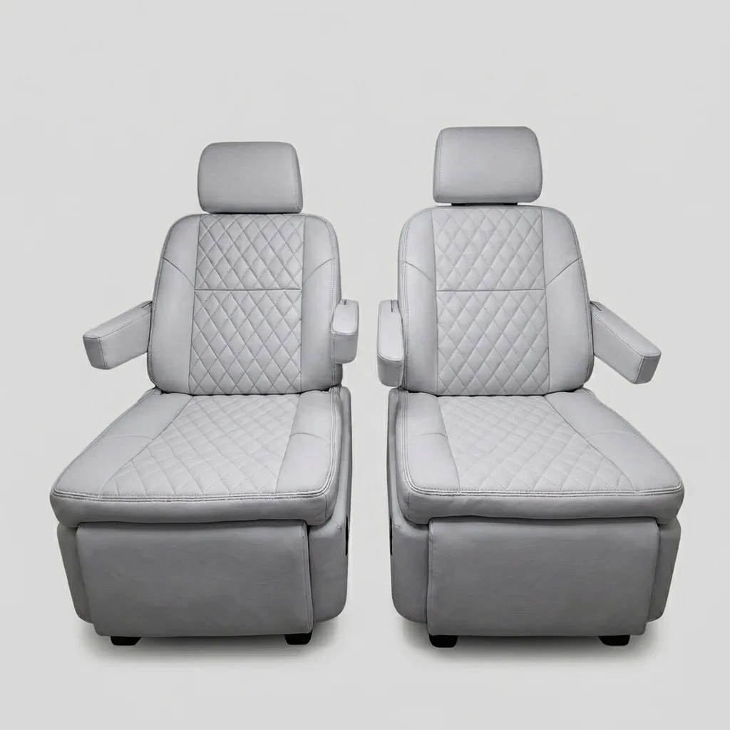 Premium light gray quilted leather captain's chairs reclined with footrests extended, showing electric reclining and footrest adjustment