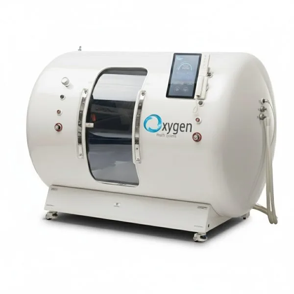 Glossy white hyperbaric oxygen chamber with a side viewing window, mounted touchscreen control panel, and connection hoses on a wheeled base