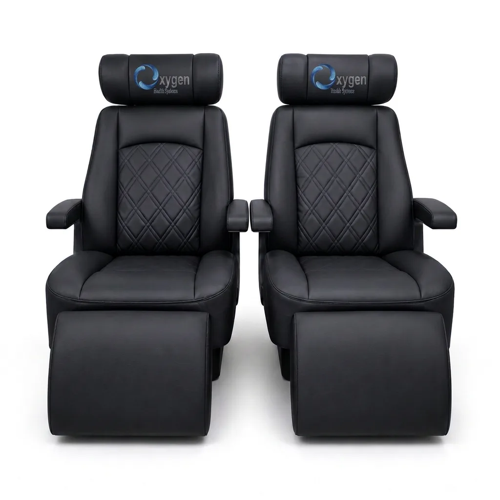 Pair of black quilted leather recliners with Oxygen Health Systems headrests and extended footrests, diamond-stitched backrests and padded armrests