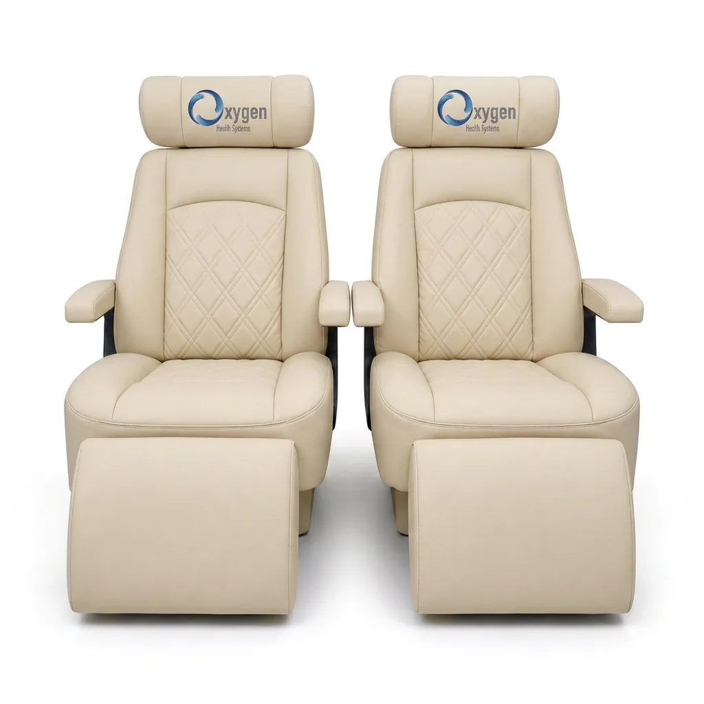 Pair of cream quilted leather recliners with Oxygen Health Systems headrests and extended footrests, diamond-stitched backrests and padded armrests